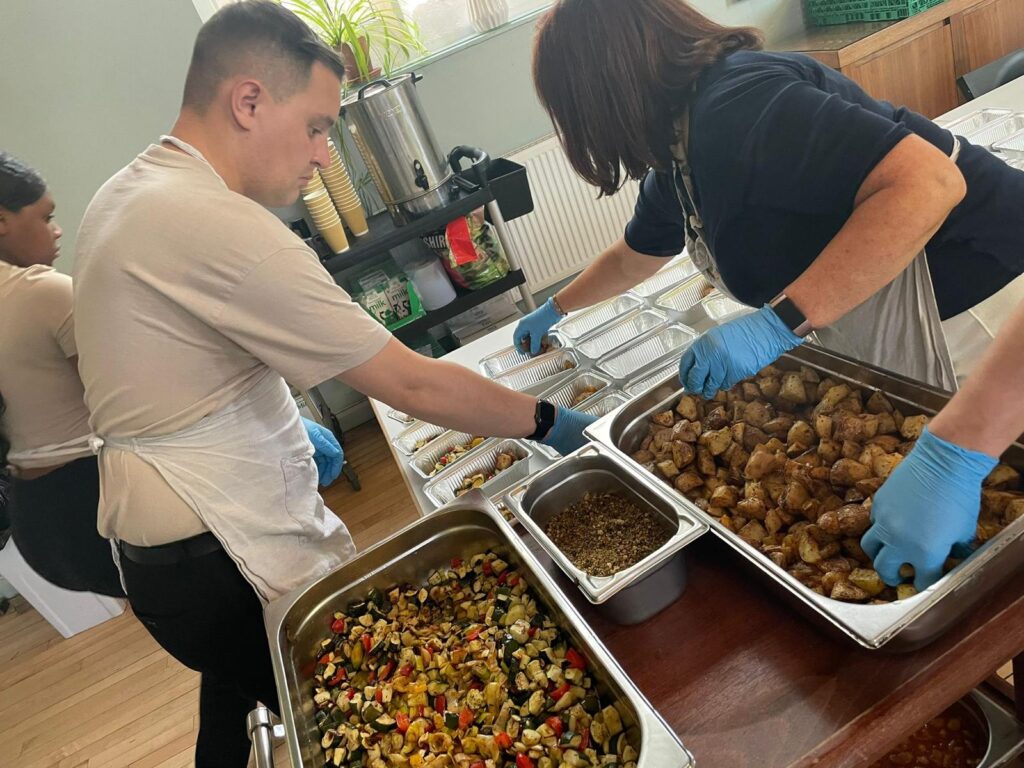 Serving roasted new potatoes and grilled vegetables